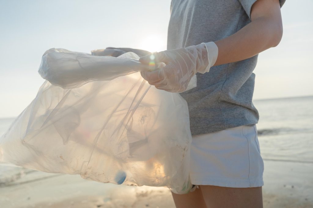 A man holding a bag of plastics